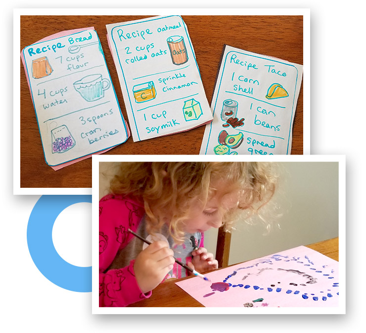 A young girl paints carefully dot patterns practicing hand control. 3 children's play recipe cards crafted from construction paper and markers.