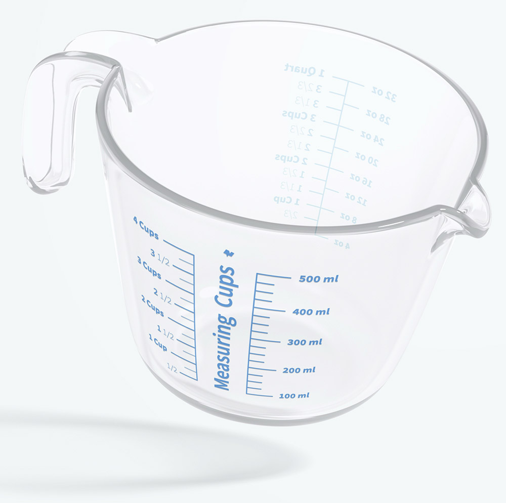 Clear Plastic Cooking Measurement Cup on White Countertop